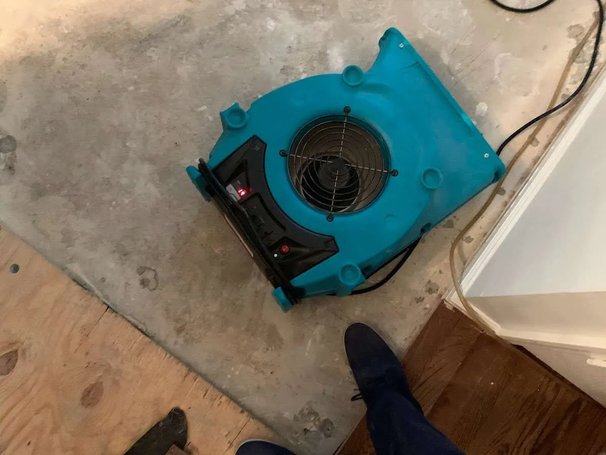 Air mover drying subfloor during Leak Detection & Repair in Sturgis